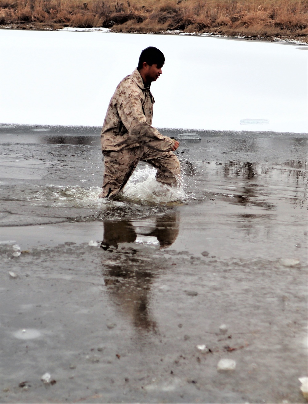 Marines jump in for cold-water immersion training at Fort McCoy