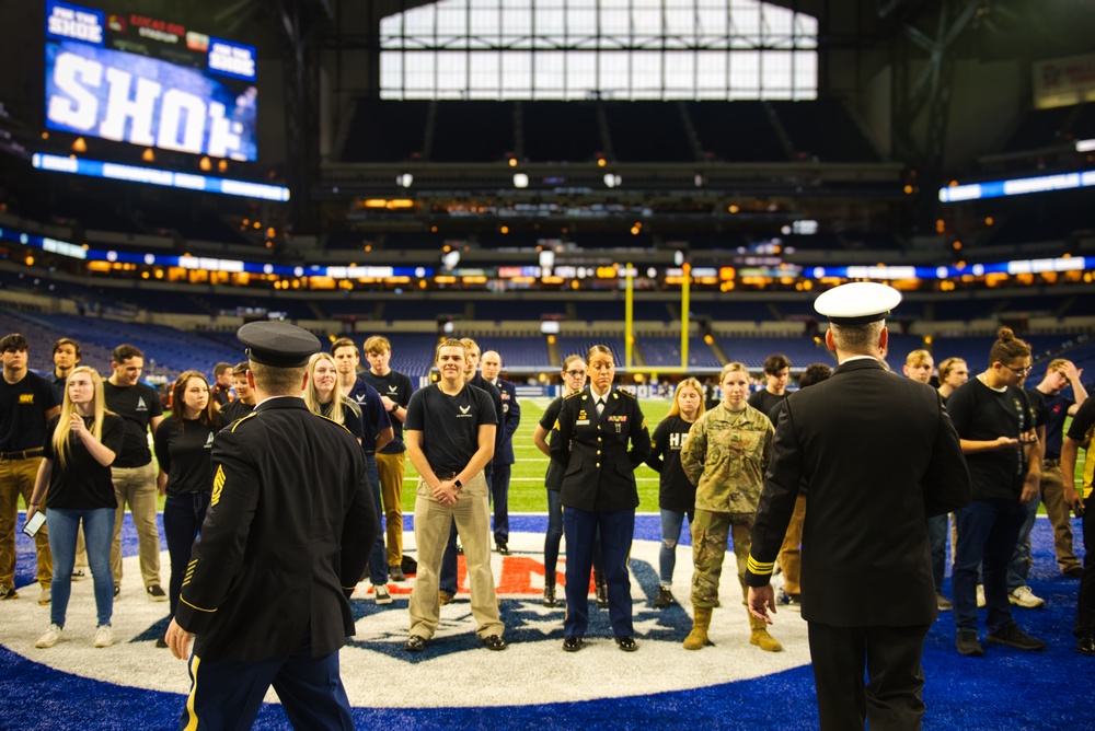 Indiana National Guardsmen support the Oath of Enlistment of future U.S. troops at Lucas Oil Stadium