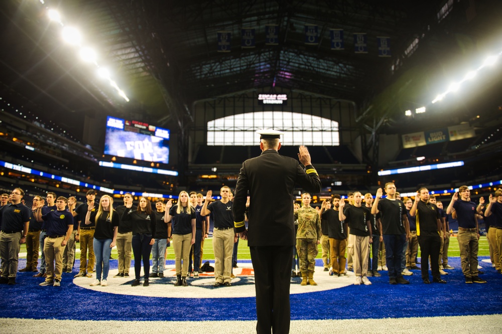 Indiana National Guardsmen support the Oath of Enlistment of future U.S. troops at Lucas Oil Stadium