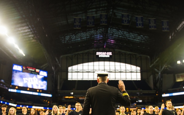 Indiana National Guardsmen support the Oath of Enlistment of future U.S. troops at Lucas Oil Stadium