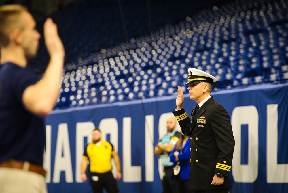 Indiana National Guardsmen support the Oath of Enlistment of future U.S. troops at Lucas Oil Stadium