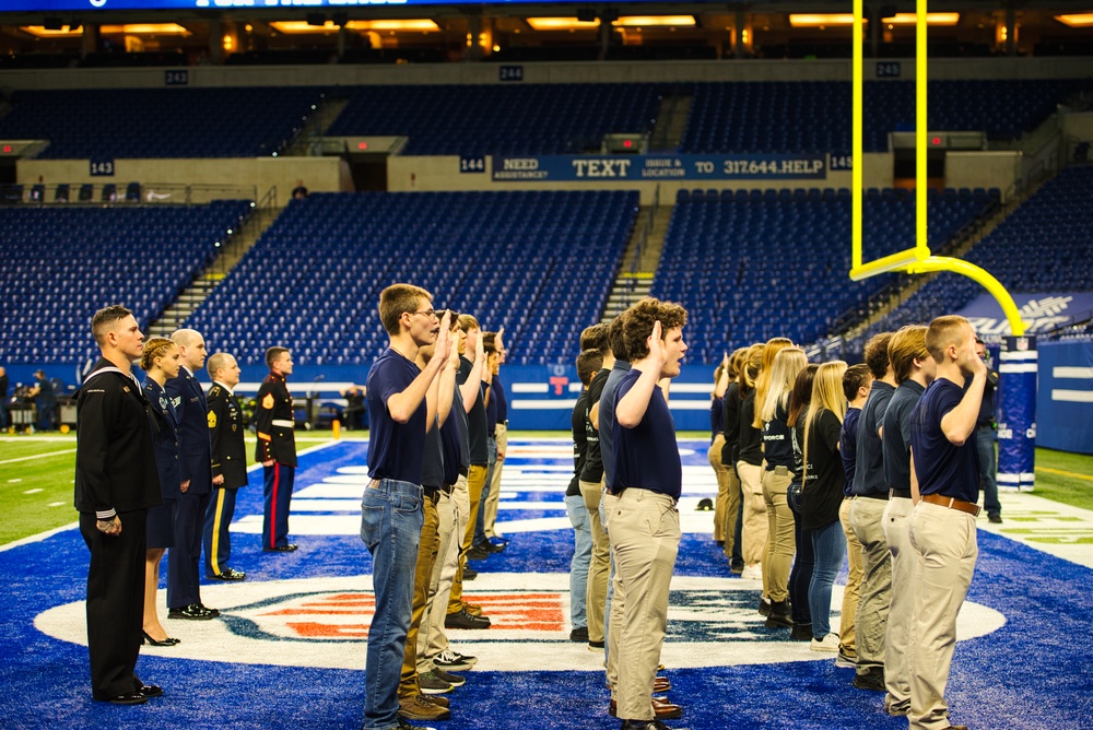 Indiana National Guardsmen support the Oath of Enlistment of future U.S. troops at Lucas Oil Stadium