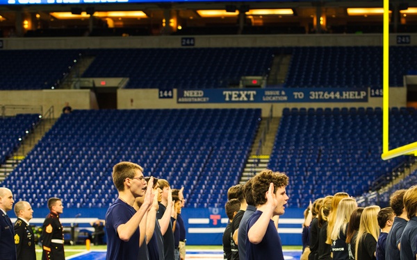 Indiana National Guardsmen support the Oath of Enlistment of future U.S. troops at Lucas Oil Stadium