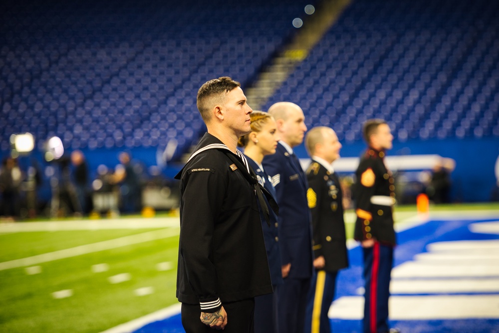 Indiana National Guardsmen support the Oath of Enlistment of future U.S. troops at Lucas Oil Stadium