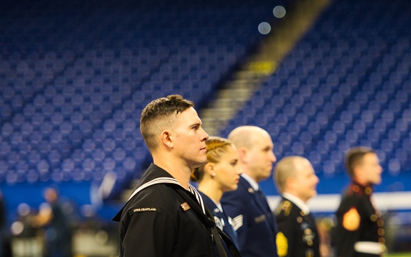 Indiana National Guardsmen support the Oath of Enlistment of future U.S. troops at Lucas Oil Stadium
