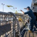 USS Milwaukee Sailor Heaves Line During Sea and Anchor Detail