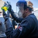 USS Milwaukee Sailor Inspects a Fuel Sample