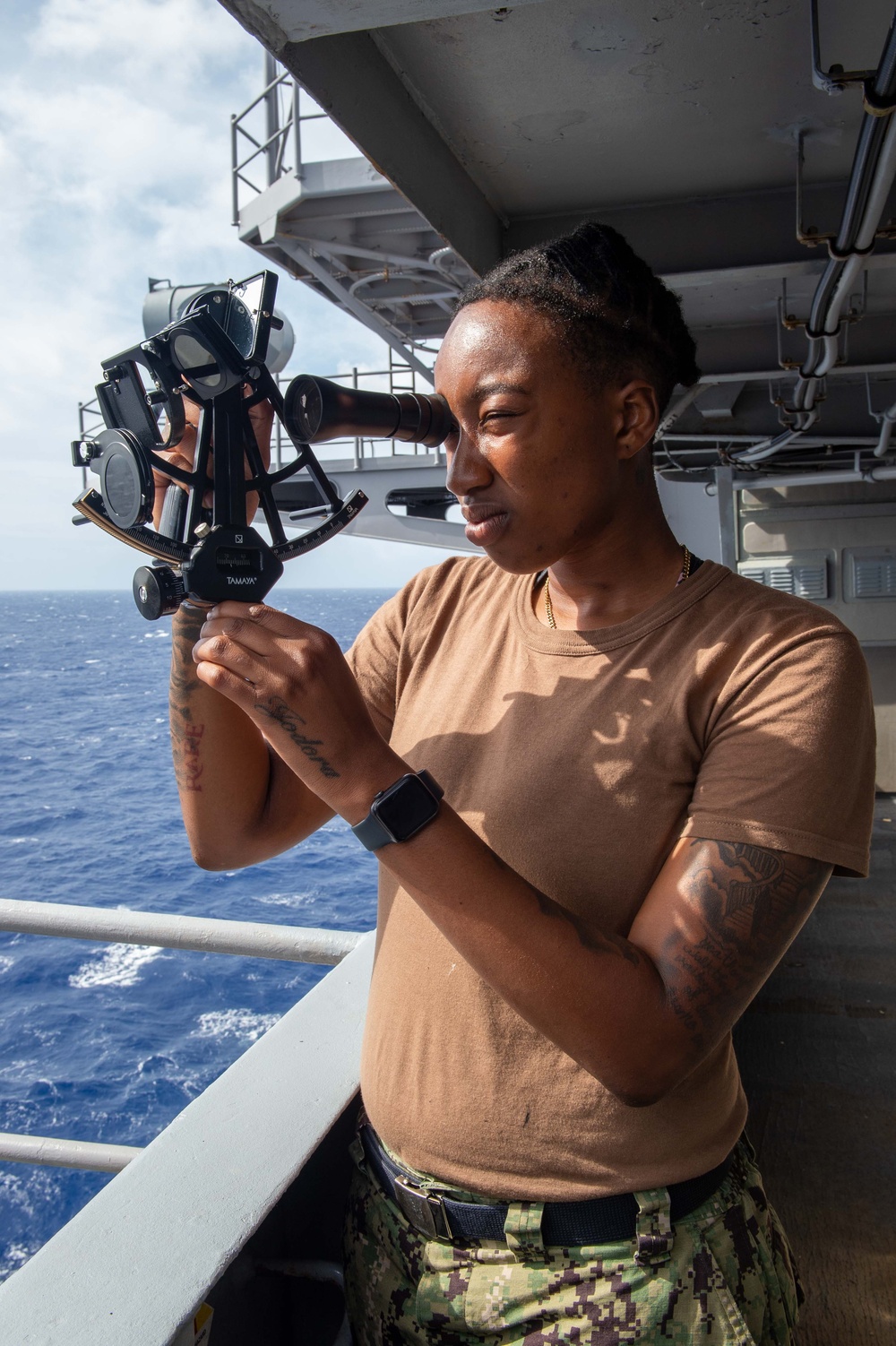 USS Carl Vinson (CVN 70) Quartermaster uses a sextant