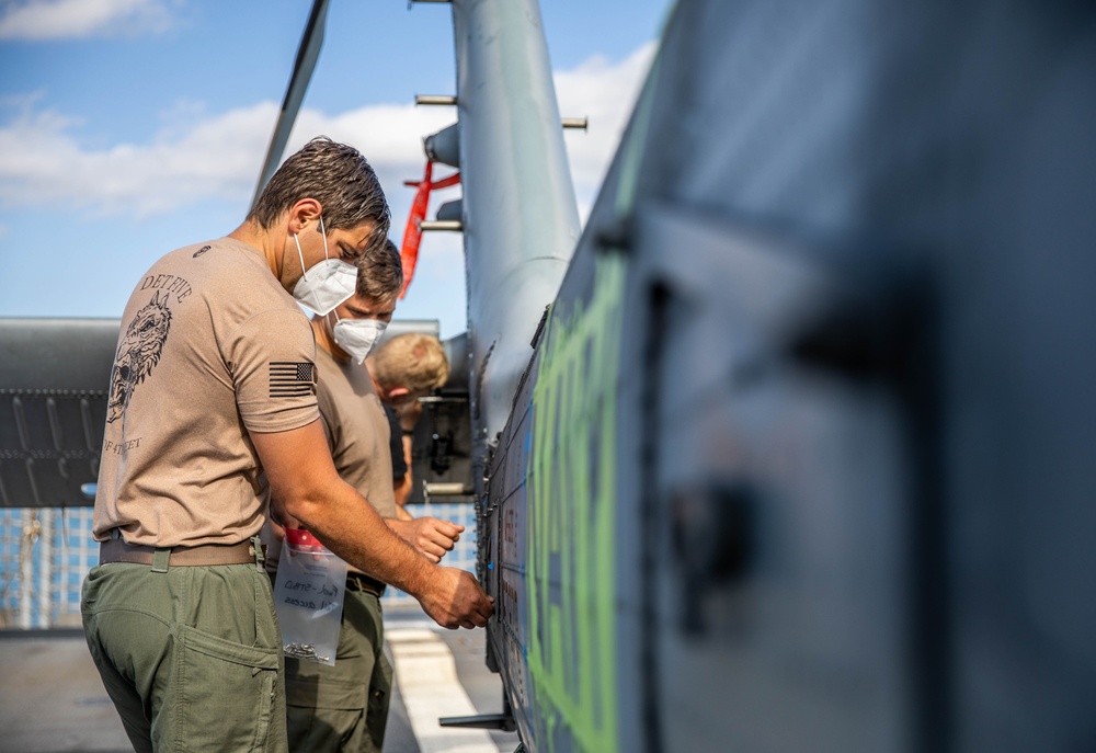 USS Milwaukee and HSC 22 Sailors Maintain Readiness