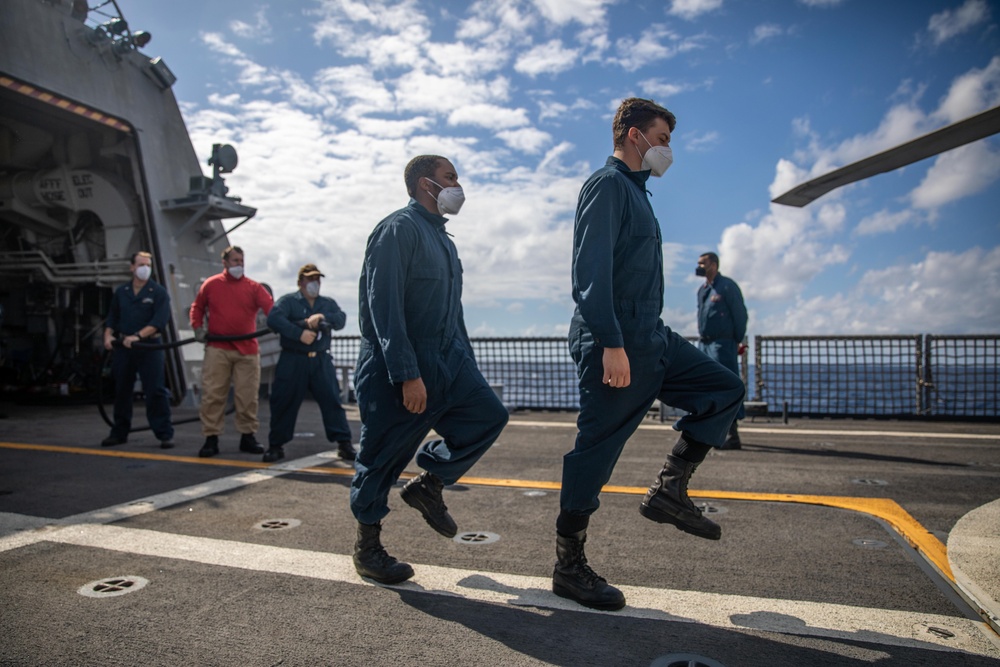USS Milwaukee Sailors Simulate Putting Out a Fire on the Flight Deck