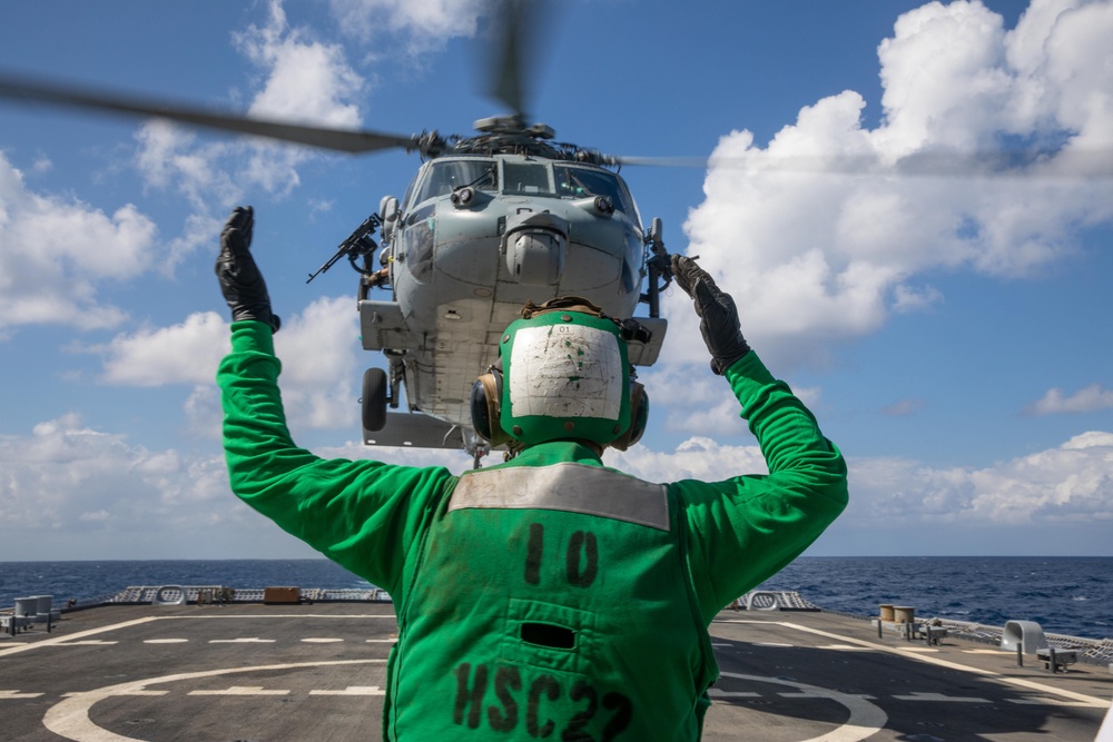 HSC 22 Sailor Directs Pilots in an MH-60S Sea Hawk Helicopter