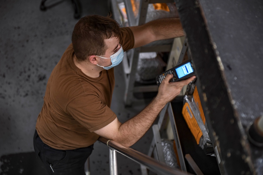 USS Carl Vinson (CVN 70) Sailor takes inventory