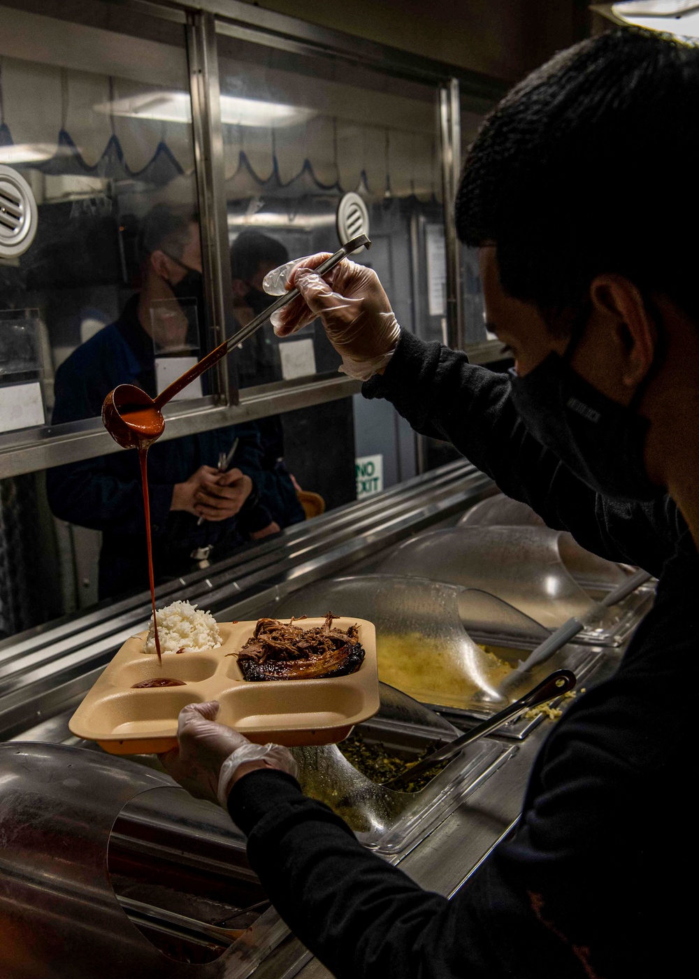 Abraham Lincoln Sailors serve food