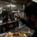 Abraham Lincoln Sailors serve food