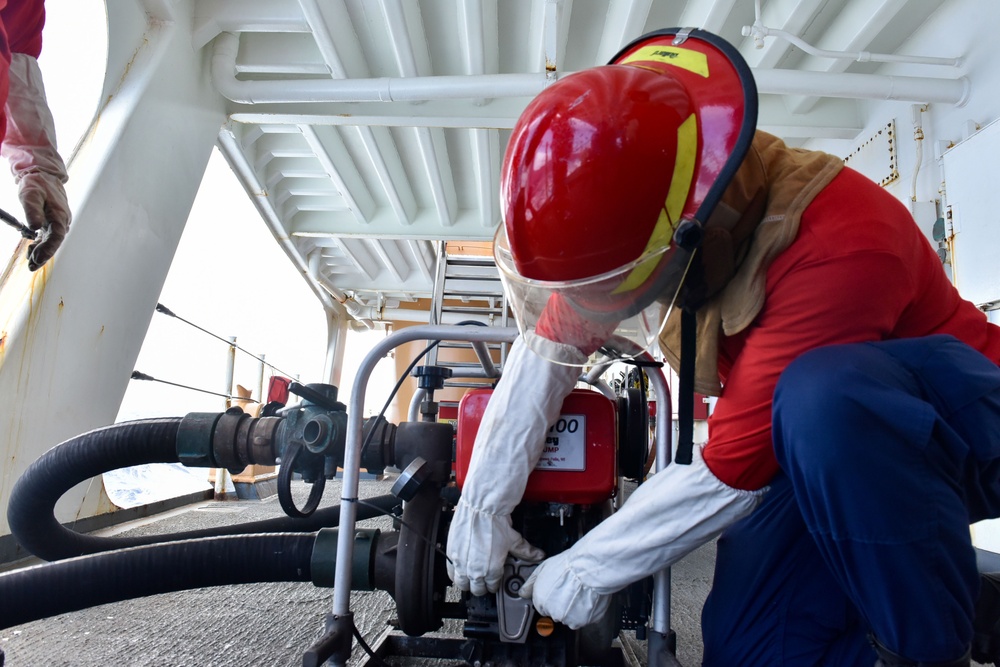 Coast Guard Cutter Polar Star crew members conduct shipboard firefighting drills