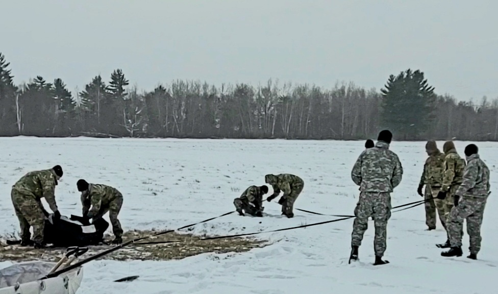 Cold-Weather Operations Course class 22-02 students learn about Arctic tent on snowy training day