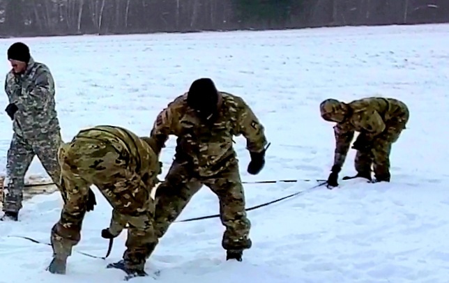 Cold-Weather Operations Course class 22-02 students learn about Arctic tent on snowy training day