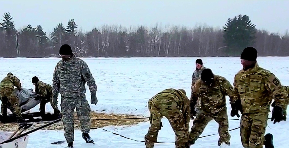 Cold-Weather Operations Course class 22-02 students learn about Arctic tent on snowy training day