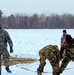 Cold-Weather Operations Course class 22-02 students learn about Arctic tent on snowy training day