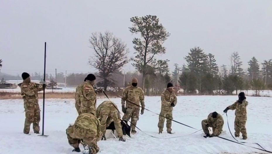 Cold-Weather Operations Course class 22-02 students learn about Arctic tent on snowy training day