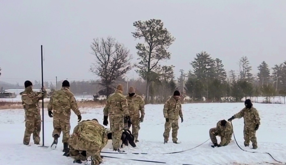Cold-Weather Operations Course class 22-02 students learn about Arctic tent on snowy training day