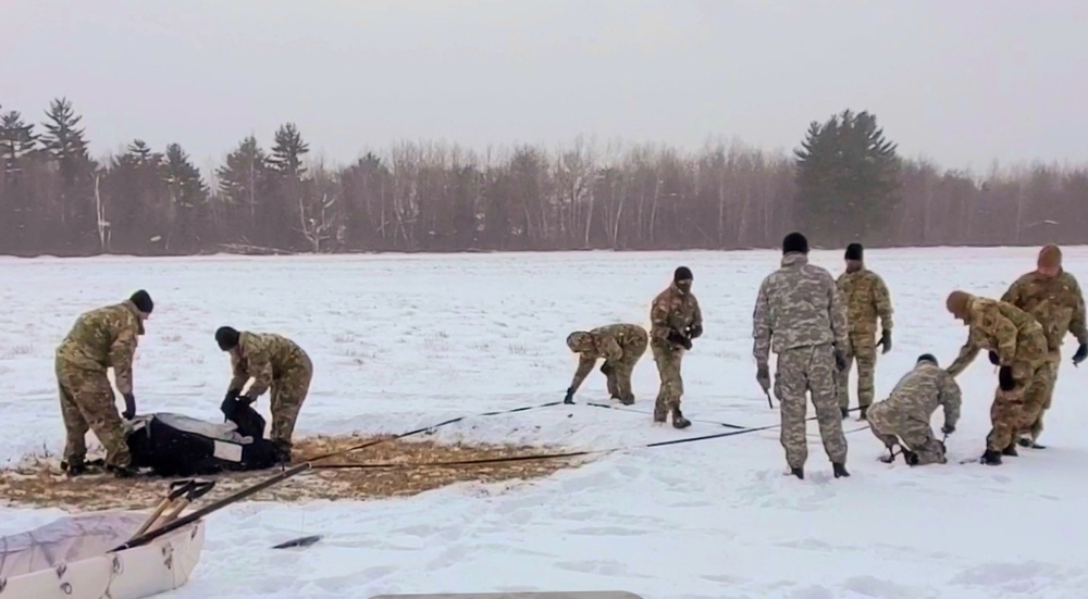 Cold-Weather Operations Course class 22-02 students learn about Arctic tent on snowy training day