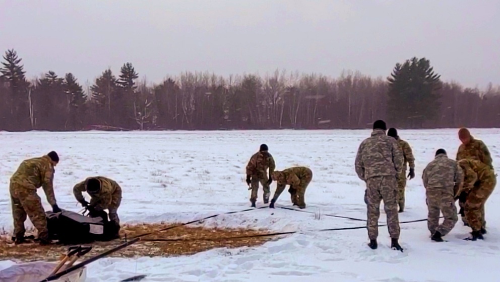Cold-Weather Operations Course class 22-02 students learn about Arctic tent on snowy training day