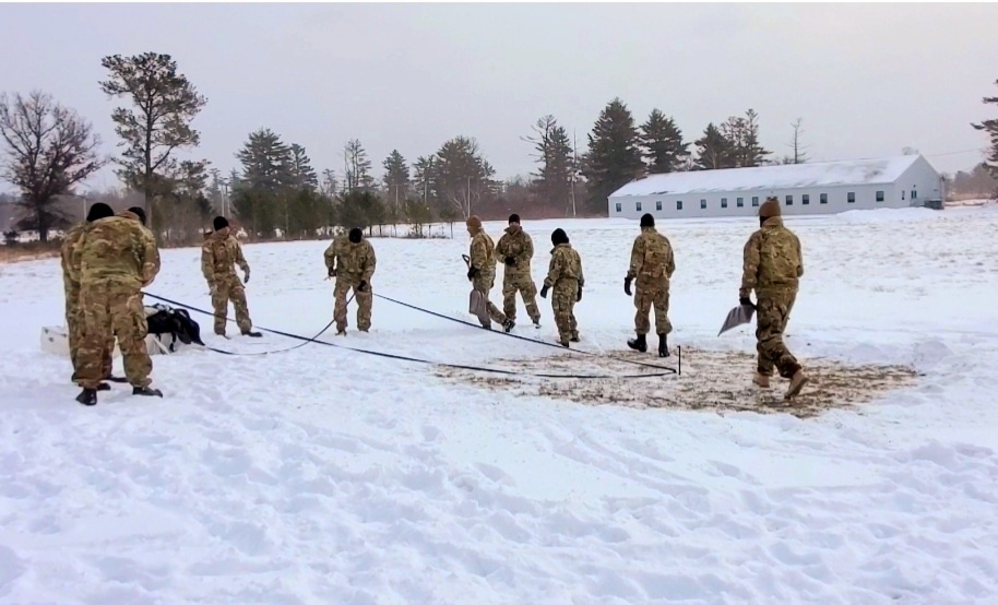 Cold-Weather Operations Course class 22-02 students learn about Arctic tent on snowy training day