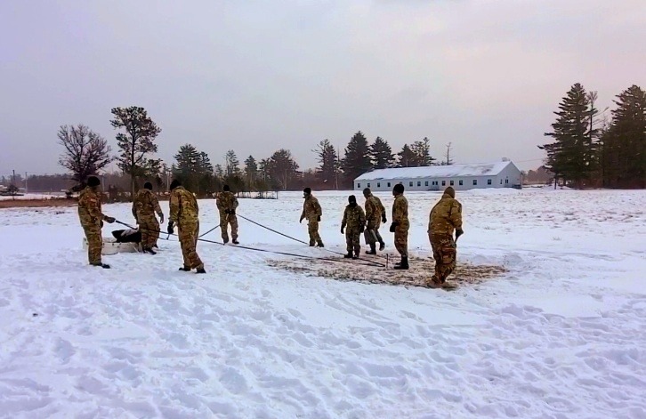 Cold-Weather Operations Course class 22-02 students learn about Arctic tent on snowy training day