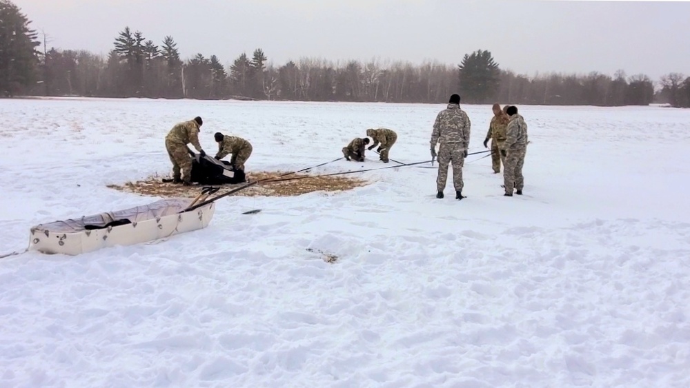 Cold-Weather Operations Course class 22-02 students learn about Arctic tent on snowy training day