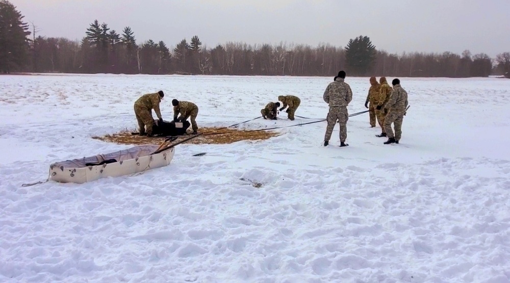 Cold-Weather Operations Course class 22-02 students learn about Arctic tent on snowy training day