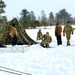 Cold-Weather Operations Course class 22-02 students learn about Arctic tent on snowy training day