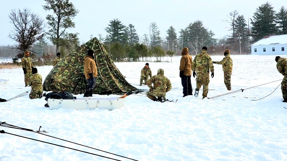 Cold-Weather Operations Course class 22-02 students learn about Arctic tent on snowy training day