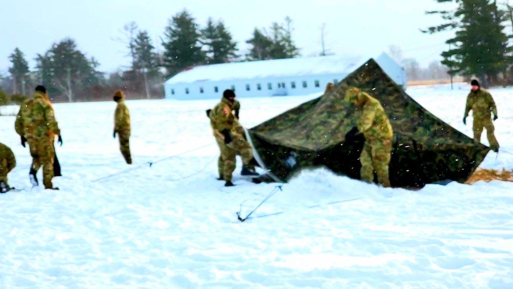 Cold-Weather Operations Course class 22-02 students learn about Arctic tent on snowy training day