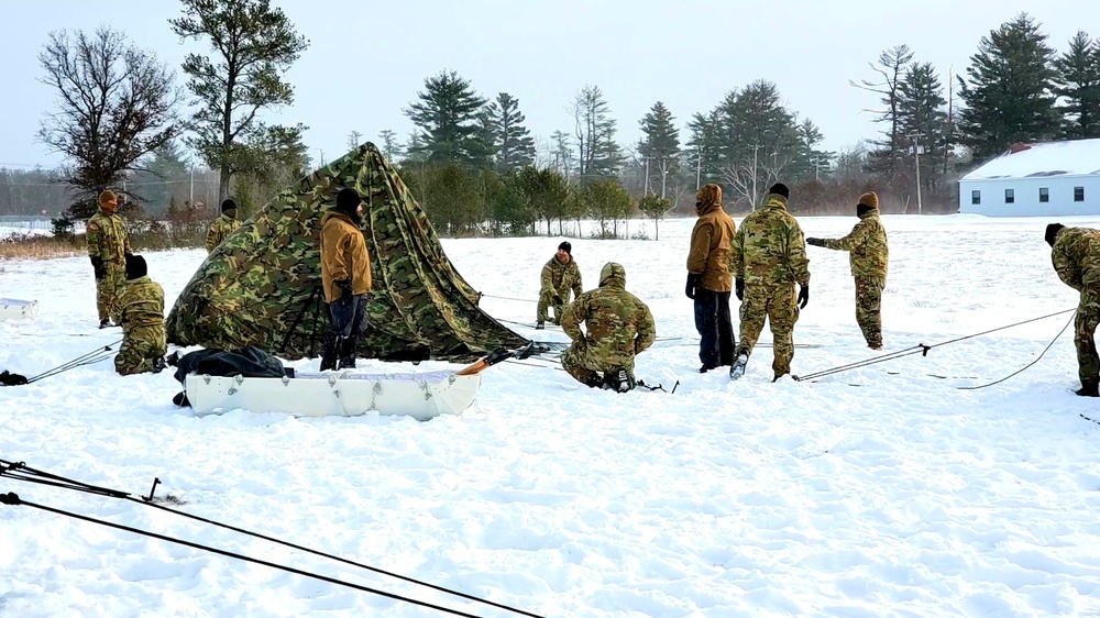 Cold-Weather Operations Course class 22-02 students learn about Arctic tent on snowy training day