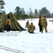 Cold-Weather Operations Course class 22-02 students learn about Arctic tent on snowy training day