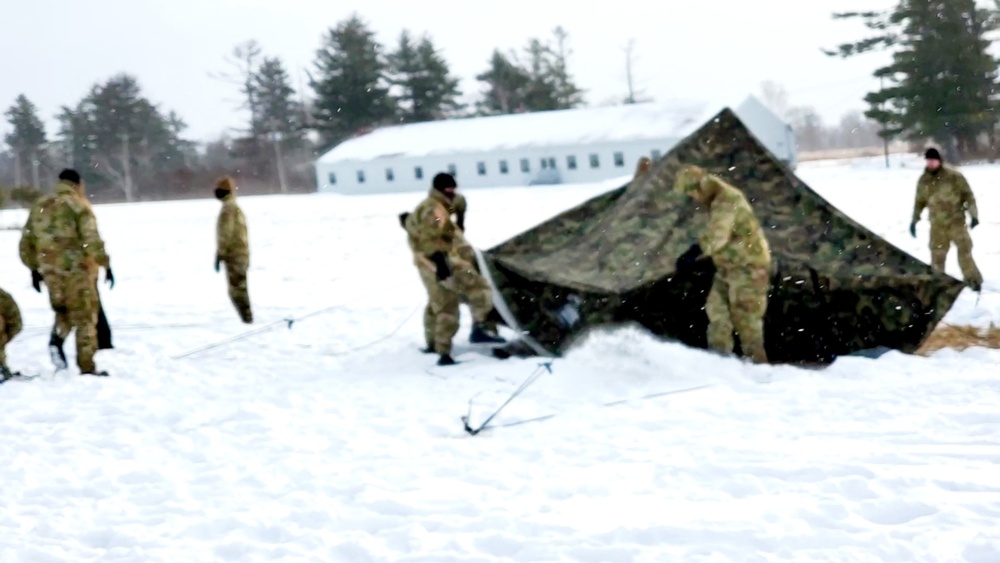 Cold-Weather Operations Course class 22-02 students learn about Arctic tent on snowy training day