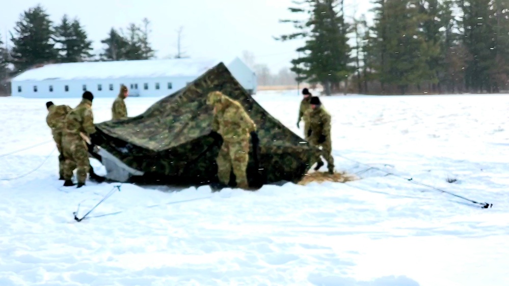 Cold-Weather Operations Course class 22-02 students learn about Arctic tent on snowy training day