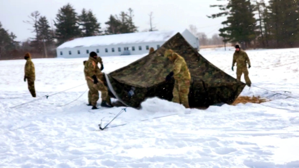 Cold-Weather Operations Course class 22-02 students learn about Arctic tent on snowy training day