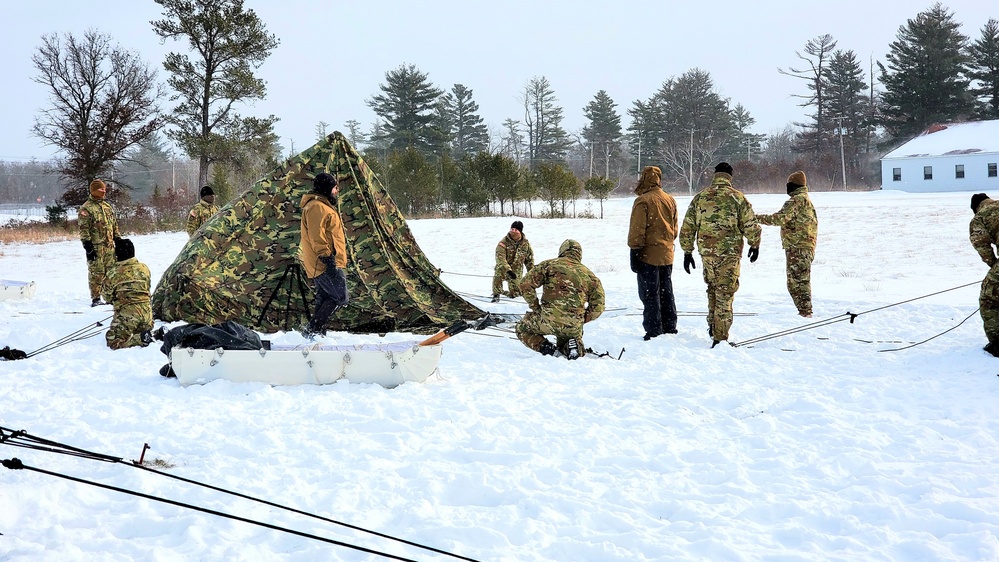 Cold-Weather Operations Course class 22-02 students learn about Arctic tent on snowy training day
