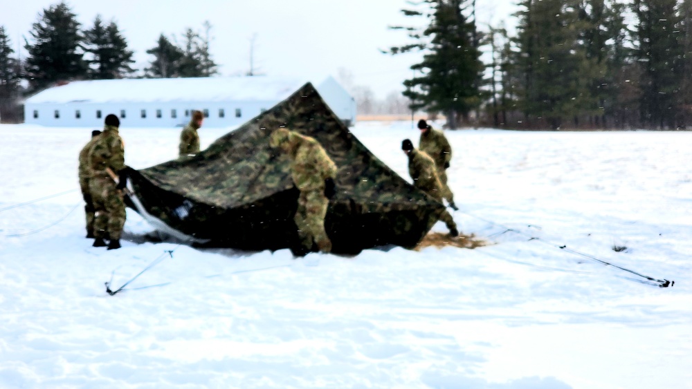 Cold-Weather Operations Course class 22-02 students learn about Arctic tent on snowy training day