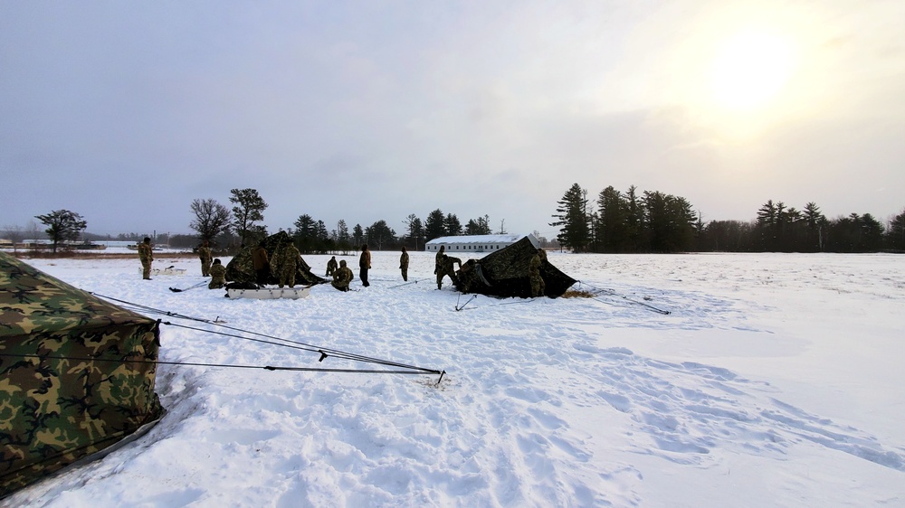 Cold-Weather Operations Course class 22-02 students learn about Arctic tent on snowy training day