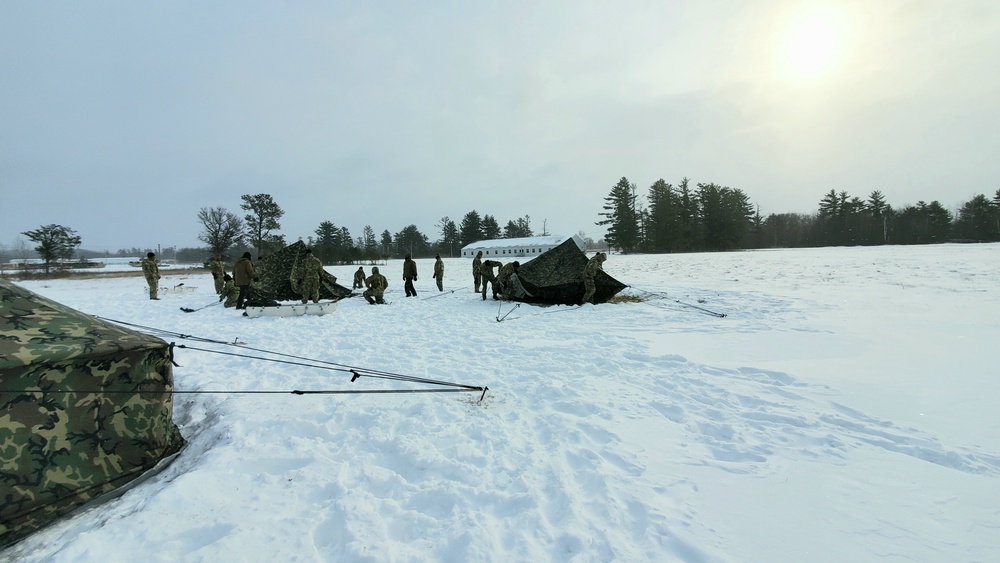 Cold-Weather Operations Course class 22-02 students learn about Arctic tent on snowy training day