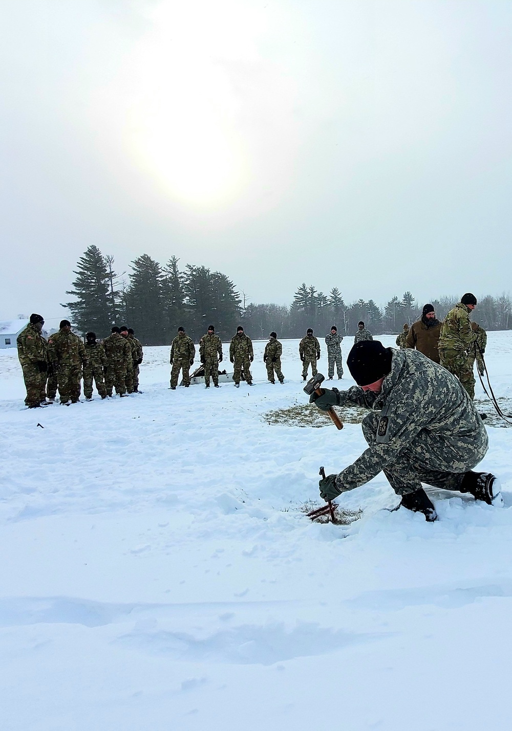 Cold-Weather Operations Course class 22-02 students learn about Arctic tent on snowy training day