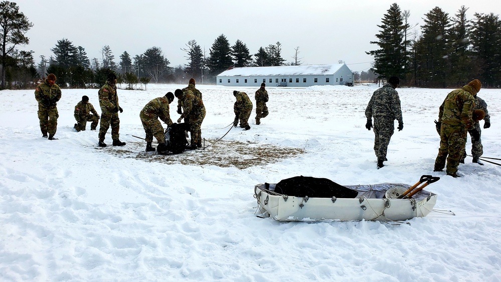 Cold-Weather Operations Course class 22-02 students learn about Arctic tent on snowy training day