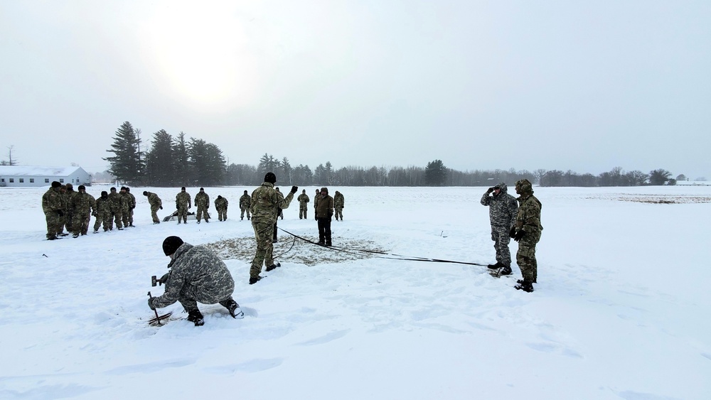 Cold-Weather Operations Course class 22-02 students learn about Arctic tent on snowy training day