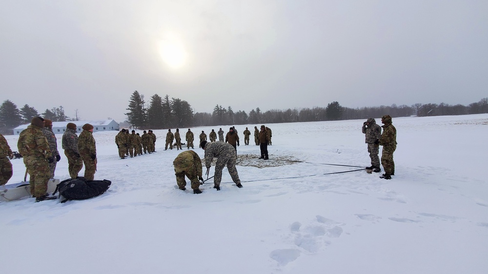 Cold-Weather Operations Course class 22-02 students learn about Arctic tent on snowy training day