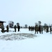 Cold-Weather Operations Course class 22-02 students learn about Arctic tent on snowy training day