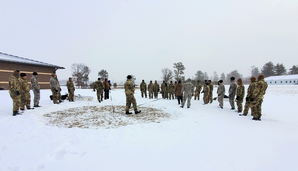 Cold-Weather Operations Course class 22-02 students learn about Arctic tent on snowy training day
