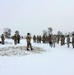 Cold-Weather Operations Course class 22-02 students learn about Arctic tent on snowy training day